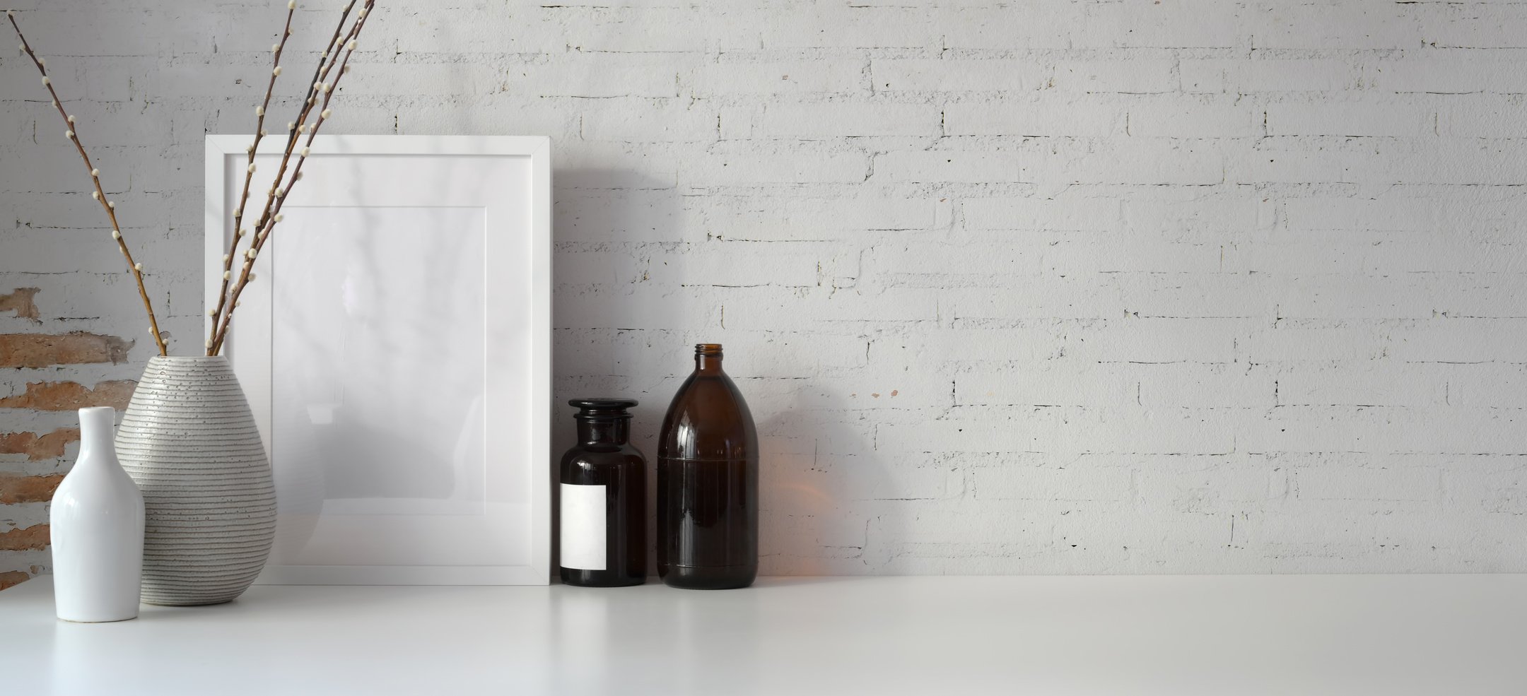 Brown Glass Bottles on White Table